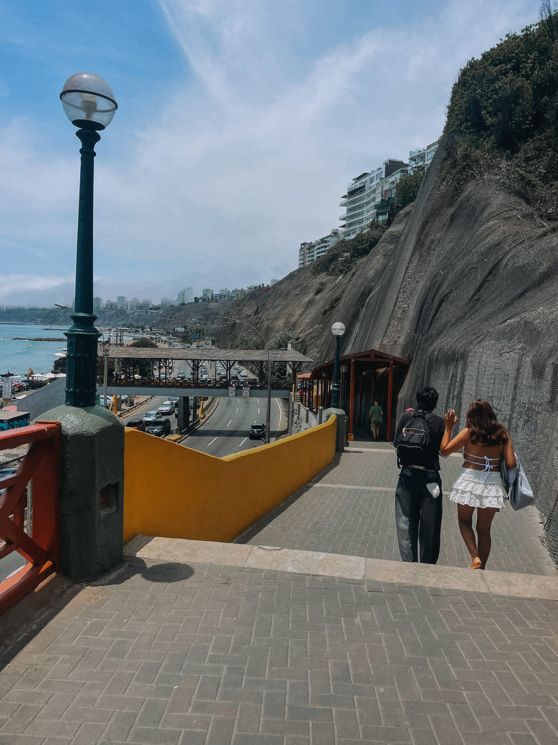 Unique things to do in Lima Stairs leading down to the water along the cliffs of Lima Peru