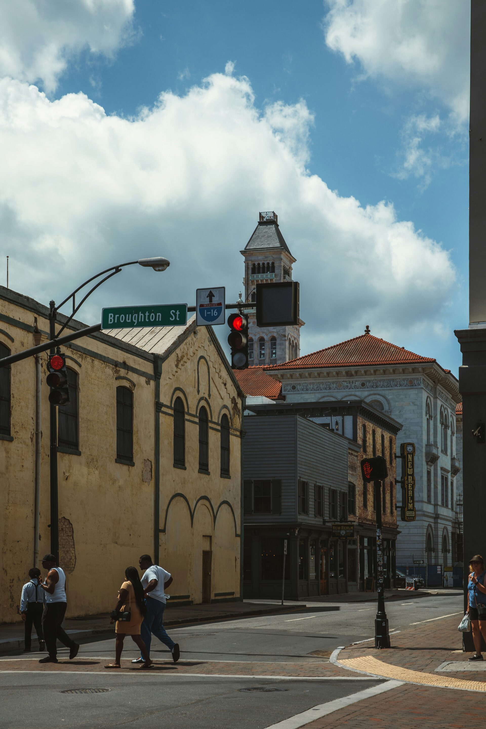 Downtown Broughton Street in Savannah with historic buildings and people walking