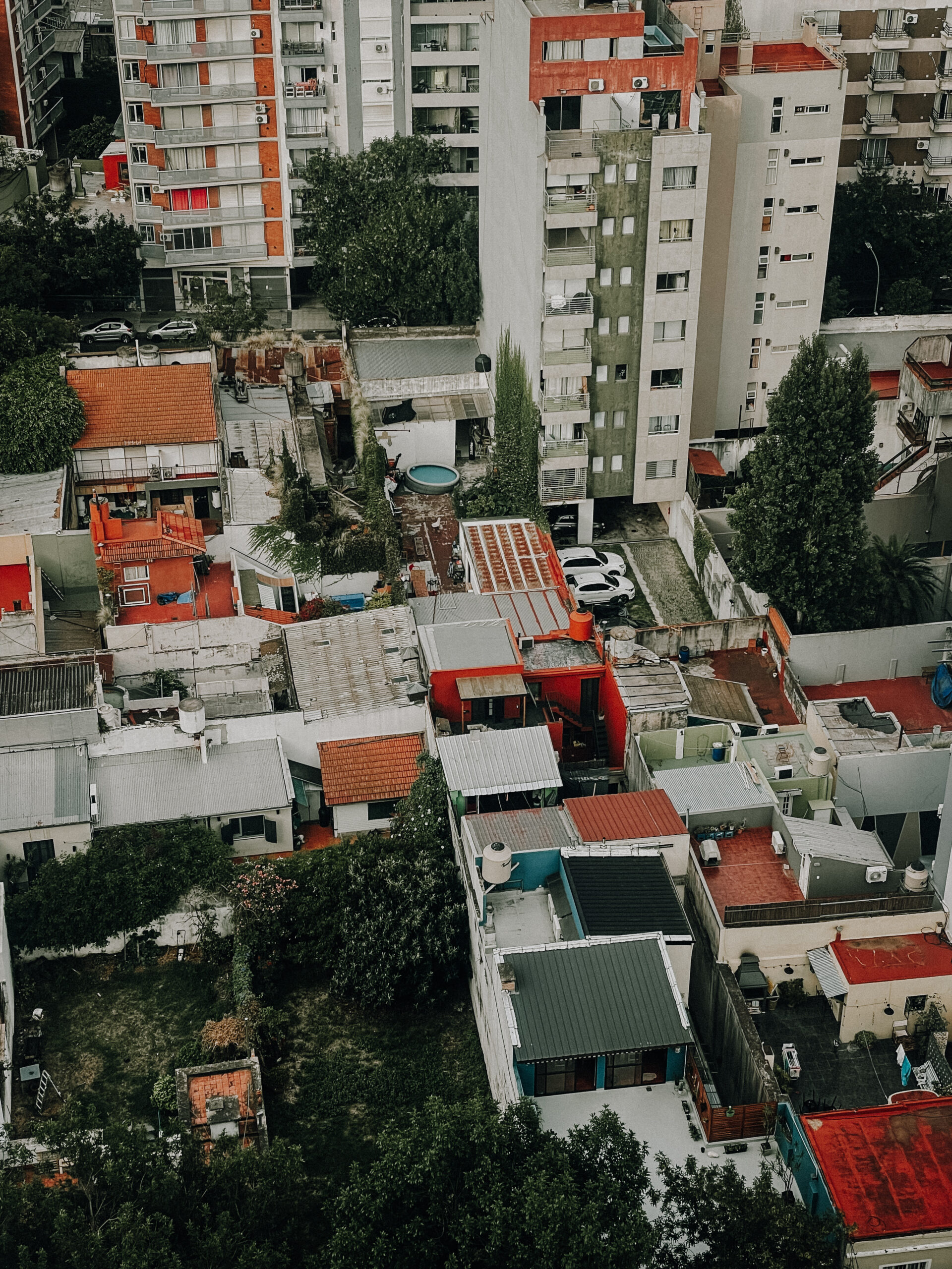 Overhead view of Caballito, Argentina, showing buildings and trees.