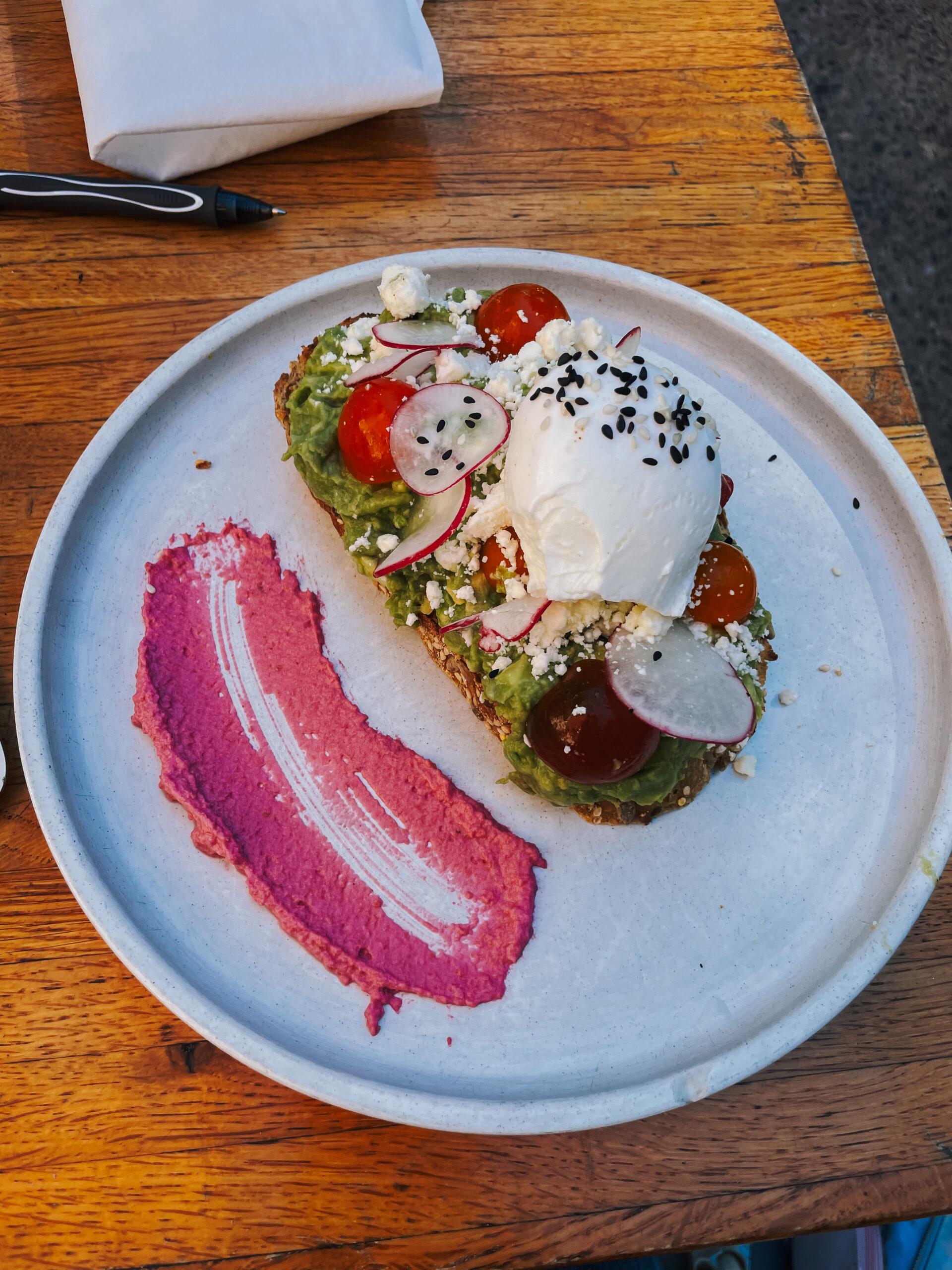 Avocado toast with poached egg and tomatoes