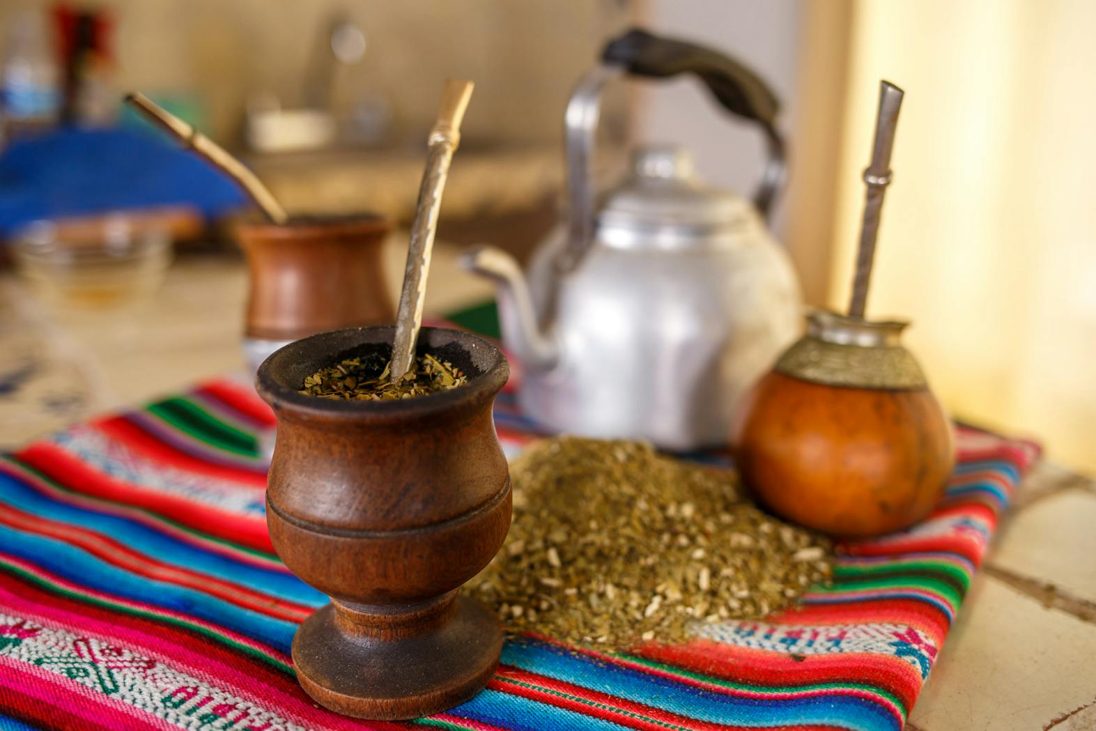 Colorful setup of yerba mate with gourd and bombilla, symbolic of South American tea culture.