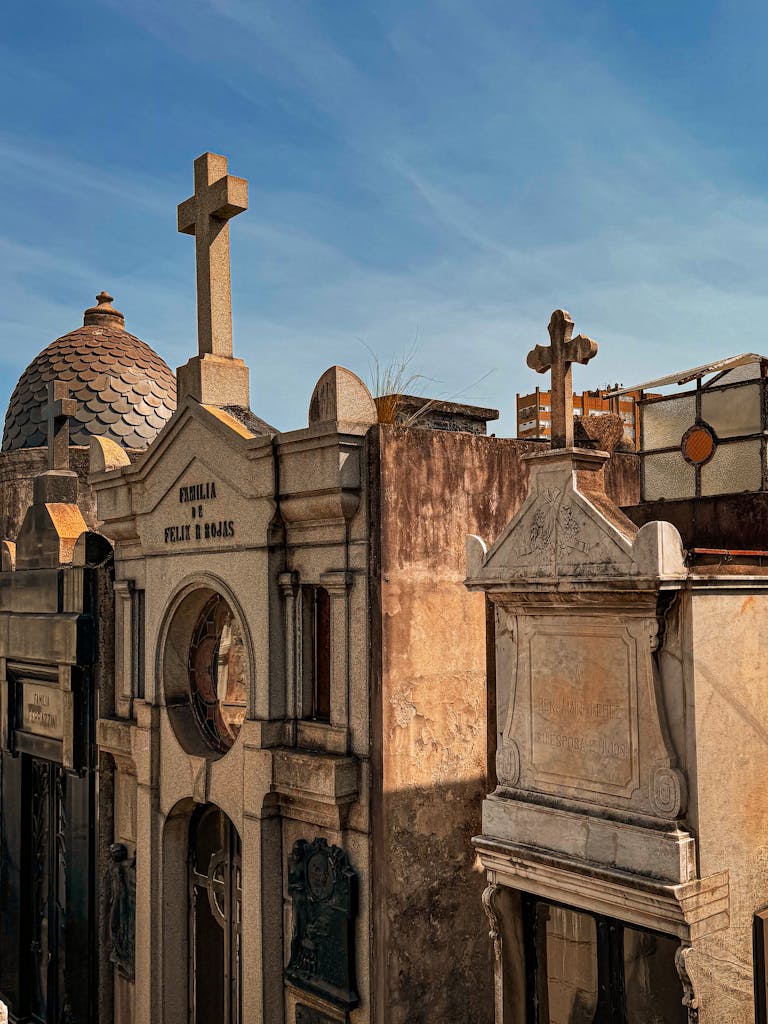 Explore the historic and ornate architecture of a Buenos Aires cemetery under a clear sky.