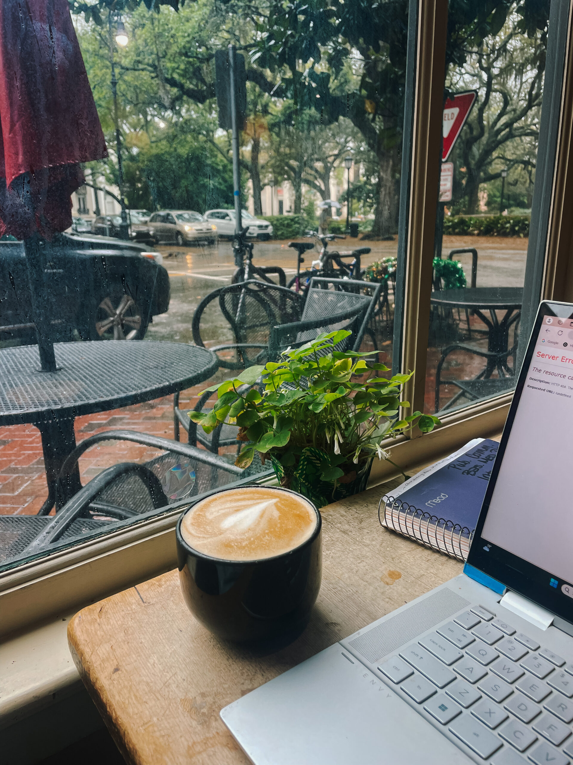 Coffee on top of table near window inside Gallery Espresso cafe in Savannah